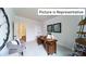 Office space featuring a modern desk, neutral walls, and ample natural light at 1010 Merganser Way, Indian Trail, NC 28079