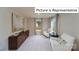 Bright sitting room with neutral walls and comfortable furnishings at 1010 Merganser Way, Indian Trail, NC 28079
