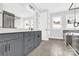 Bright bathroom featuring double sinks, modern fixtures, and tiled floors and walls for a clean and luxurious feel at 11327 James Coy Rd, Davidson, NC 28036