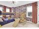 Fun bedroom with bunk bed, climbing wall, neutral carpet and playful wallpaper at 11327 James Coy Rd, Davidson, NC 28036