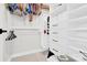 Organized walk-in closet with built-in shelving, hanging racks, and ample storage space at 11327 James Coy Rd, Davidson, NC 28036
