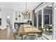 Bright dining room with modern light fixture and wet bar, perfect for entertaining guests at 11327 James Coy Rd, Davidson, NC 28036