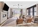 Inviting living room with brick fireplace and large windows, perfect for entertaining or relaxing with style at 11327 James Coy Rd, Davidson, NC 28036