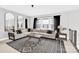 Cozy living room features a large sectional sofa, modern decor, and stylish area rug for comfortable living at 11327 James Coy Rd, Davidson, NC 28036