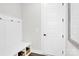 Well-organized mudroom with built-in bench, hooks, and storage baskets for optimal organization at 11327 James Coy Rd, Davidson, NC 28036