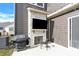 Cozy patio area with fireplace, grill, and TV, perfect for outdoor entertaining at 11327 James Coy Rd, Davidson, NC 28036