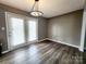 Dining room with sliding door access to outdoor space and neutral wall colors at 121 Deertrack Dr, Mount Holly, NC 28120