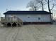 Backyard view of home showing small deck, siding, and landscaping at 1309 Meadow Ave, Kannapolis, NC 28083