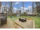 Large backyard features a play set, a dining area, and mature trees at 1501 Laurel Ln, Gastonia, NC 28054