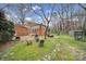 Beautiful backyard features mature trees and a grass lawn for playing or relaxing at 1501 Laurel Ln, Gastonia, NC 28054