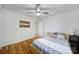 Simple bedroom with a ceiling fan, wood floors, and natural light at 1501 Laurel Ln, Gastonia, NC 28054
