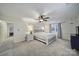 Spacious bedroom features plush carpet, a ceiling fan, and large windows at 1501 Laurel Ln, Gastonia, NC 28054