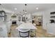Open-concept kitchen with a large island, stainless steel appliances, and seamless flow into the dining area at 1501 Laurel Ln, Gastonia, NC 28054