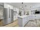 Spacious kitchen with stainless steel refrigerator, center island, and seamless flow to adjacent living spaces at 1501 Laurel Ln, Gastonia, NC 28054