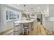 Modern kitchen with an island, white cabinetry, stainless appliances, and ample natural light at 1501 Laurel Ln, Gastonia, NC 28054