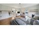 Relaxing living area featuring hardwood floors, a gray sectional sofa, and access to the backyard at 1501 Laurel Ln, Gastonia, NC 28054