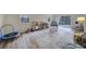 Spacious play room area with toys, table, rug and sliding glass doors leading to deck at 1501 Laurel Ln, Gastonia, NC 28054