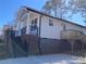 Charming home with a welcoming front porch, brick foundation, and a wooden deck for outdoor enjoyment at 1537 Poston Cir, Gastonia, NC 28054
