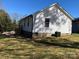 The side and rear of a house featuring white siding at 1537 Poston Cir, Gastonia, NC 28054