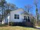 Inviting single-Gathering home with tidy lawn and covered front porch under a clear blue sky at 1537 Poston Cir, Gastonia, NC 28054