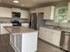 Well-equipped kitchen with stainless steel appliances, granite counters, and a center island at 1537 Poston Cir, Gastonia, NC 28054