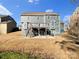 Backyard featuring a deck and patio with an expansive lawn at 15827 Arabian Mews Ln, Charlotte, NC 28278