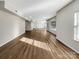Spacious basement space with neutral walls, vinyl wood flooring, and natural light from windows at 15827 Arabian Mews Ln, Charlotte, NC 28278