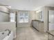 Bright bathroom featuring a soaking tub and granite countertops at 15827 Arabian Mews Ln, Charlotte, NC 28278