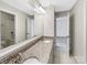 Bathroom with a granite countertop and double sinks at 15827 Arabian Mews Ln, Charlotte, NC 28278