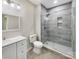 Bathroom featuring granite countertop vanity, toilet, mirror, and glass enclosed walk-in shower at 15827 Arabian Mews Ln, Charlotte, NC 28278