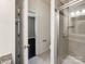 Modern bathroom featuring a glass-enclosed shower and tiled walls at 15827 Arabian Mews Ln, Charlotte, NC 28278