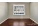 Bright bedroom featuring a large window and neutral walls at 15827 Arabian Mews Ln, Charlotte, NC 28278