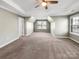Cozy bedroom with vaulted ceilings, carpet, and large windows at 15827 Arabian Mews Ln, Charlotte, NC 28278