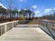 Outdoor wooden deck overlooking a natural setting at 15827 Arabian Mews Ln, Charlotte, NC 28278