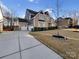 Charming two-story home featuring a manicured lawn, beautiful landscaping, and a 2-car garage at 15827 Arabian Mews Ln, Charlotte, NC 28278