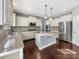 Spacious kitchen featuring granite countertops, stainless steel appliances, and a kitchen island at 15827 Arabian Mews Ln, Charlotte, NC 28278