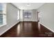 Bright living room with hardwood floors and large windows at 15827 Arabian Mews Ln, Charlotte, NC 28278