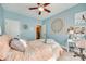 Comfortable bedroom showcasing a tapestry wall hanging, a desk, and natural light at 1823 Rain Forest Dr, York, SC 29745