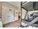 View of bedroom with lofted bed, showing closet doors and view into another room at 1823 Rain Forest Dr, York, SC 29745