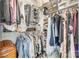 Well-organized closet with multiple shelves and hanging rods, offering ample storage space at 1823 Rain Forest Dr, York, SC 29745