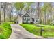 Inviting home with attached garage, long driveway, and well-maintained lawn at 1823 Rain Forest Dr, York, SC 29745