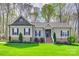 Charming single-story home with stone accents, manicured lawn, and inviting entryway at 1823 Rain Forest Dr, York, SC 29745