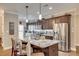 Kitchen island with pendant lighting, stainless steel appliances, and seating at 1823 Rain Forest Dr, York, SC 29745