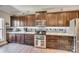 Well-equipped kitchen with granite countertops, dark cabinets, and stainless steel appliances at 1823 Rain Forest Dr, York, SC 29745
