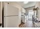 Functional laundry room with appliances, storage cabinets, and natural light at 1823 Rain Forest Dr, York, SC 29745