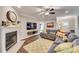 Cozy living room with fireplace, mounted television, and comfortable seating at 1823 Rain Forest Dr, York, SC 29745