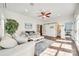 Sun-filled living space offers hardwood floors, cozy seating, and access to a powder room through a sliding barn door at 1823 Rain Forest Dr, York, SC 29745