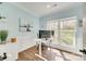 Bright office space featuring a large window, a modern desk setup, and stylish decor for a productive work environment at 1823 Rain Forest Dr, York, SC 29745