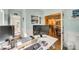 Office space boasts natural light, modern desk setup, view to dining room, creating a serene and functional work area at 1823 Rain Forest Dr, York, SC 29745
