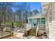 Backyard with a view of the deck, sunroom, inground pool, and woods at 207 Crossing Ave, Belmont, NC 28012